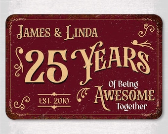 May include: A maroon metal sign with the text "James & Linda" and "25 Years Of Being Awesome Together." The sign has a distressed, vintage look with decorative flourishes and the year "Est. 2010."