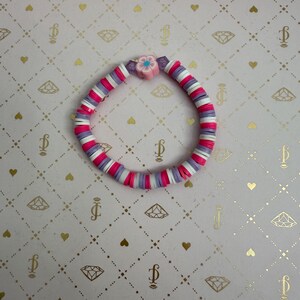 Pink, Purple & White Bracelet with Flower Detail