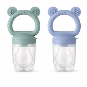 May include: Two baby food feeders, one in a muted green and the other in a soft blue. Each has a clear, bulbous container with a textured interior, a matching colored handle, and bear-shaped ears.