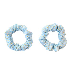 May include: Two light blue scrunchies with a white and yellow floral pattern. These hair accessories are made of a soft fabric and are perfect for adding a touch of color to any hairstyle. Each scrunchie is approximately 4 inches in diameter.