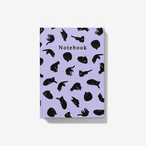 May include: A notebook with a light purple cover featuring a pattern of black cat illustrations in various poses. The word "Notebook" is printed in black at the top. The notebook is rectangular and has a clean, modern design.