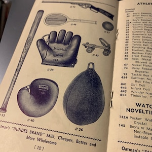 May include: A page from a vintage catalog featuring a variety of sports equipment and toys. The items include a baseball bat, a tennis racket, a catcher's mitt, a roller skate, a punching bag, a baseball, and a doll. The catalog page also includes the text "Purity First" and "Dundee Brand" Milk, Cheaper, Better and More Wholesome.
