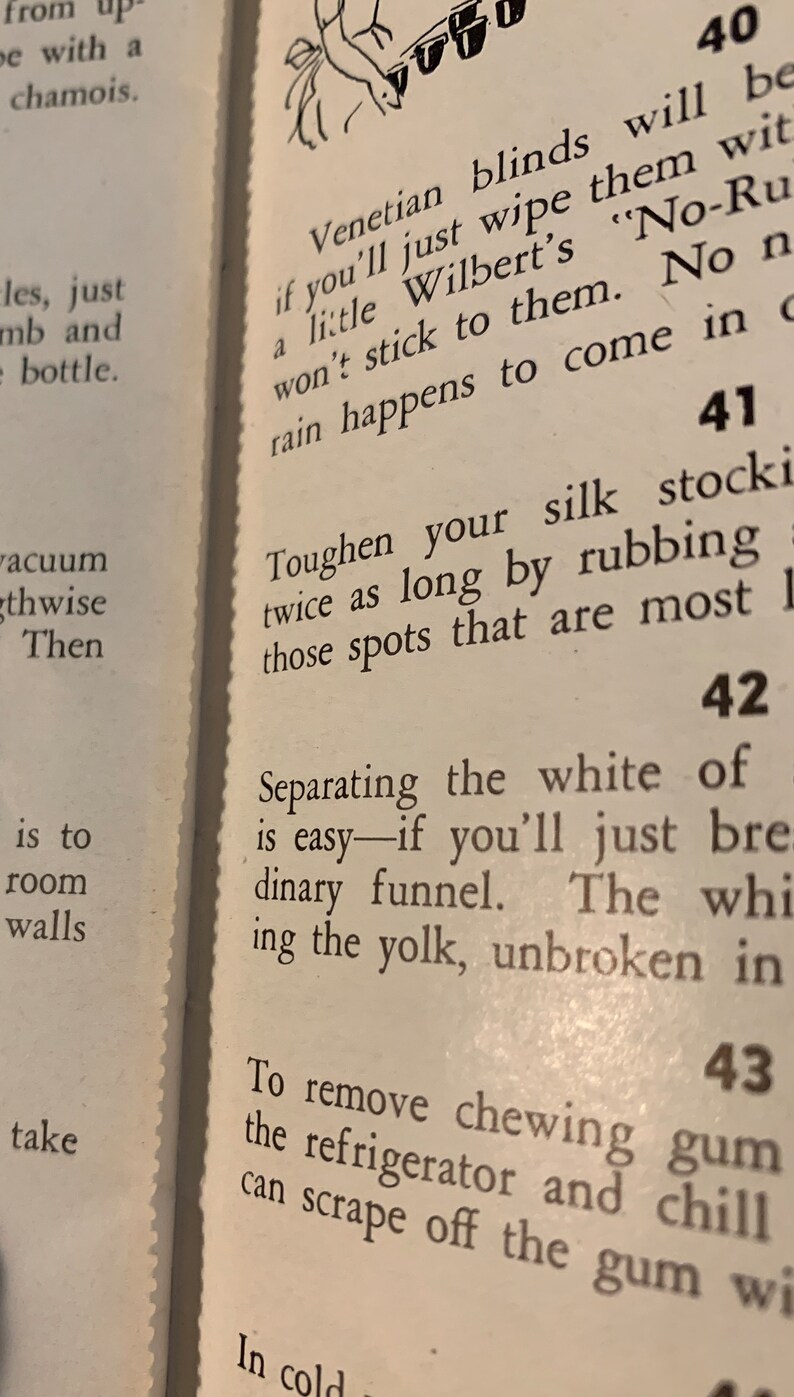 May include: A page from a vintage book with tips on how to clean and care for household items. The page features numbered tips, including how to clean Venetian blinds, toughen silk stockings, and separate egg yolks.