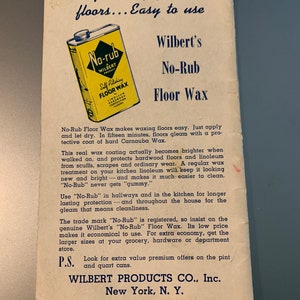May include: A yellow and blue can of No-Rub Self Polishing Floor Wax, a Wilbert product. The can is labeled with the text "No-Rub" and "Wilbert Product". The text "Self Polishing Floor Wax" is also on the can. The can is sitting on a white background with text about the product.
