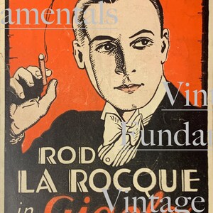 May include: Vintage Fundamentals in Gigolo by Rod La Rocque. A black and white illustration of a man in a tuxedo holding a cigarette. The text is in red and white.