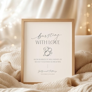 May include: A white sign with black text that reads "bursting with love". The sign also includes a graphic of bubbles and the text "Blow bubbles of well wishes as we exit together as Mr & Mrs Sally and Authing November 10th 20XX".