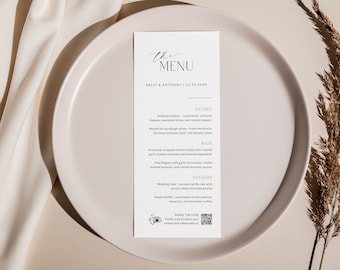 May include: A white card with black text on a white plate. The card has the words "The Menu" at the top, followed by "Sally & Anthony | 12.12.20XX". The menu includes entrees, main courses, and desserts. There is a QR code at the bottom of the card that says "Share the Love" and asks guests to share photos and videos.