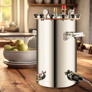 May include: A stainless steel pressure cooker with multiple valves and gauges. The cooker is sitting on a wooden table with a bowl of green apples in the background.