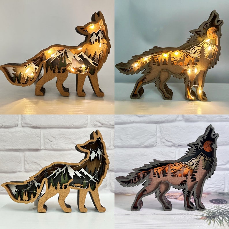 May include: Four wooden animal silhouettes with a mountain scene inside. The animals are a fox and a wolf, each shown in two poses. The silhouettes are lit from behind with warm white LED lights.