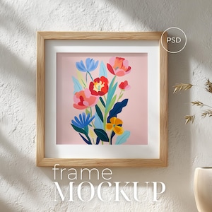 Puede incluir: Una taza de cerámica blanca con un asa negra y el texto "But First, Coffee" en negro, con una fuente de estilo manuscrito. La taza está sobre una superficie blanca.