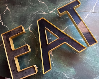 3 MARQUEE letters: EAT repurposed industrial signage gold black plastic wall decor steampunk kitchen lounge artist nook 10”