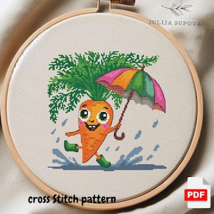 May include: Cross stitch pattern of a cartoon carrot with a happy face holding an umbrella. The carrot is wearing green rain boots and is standing in a puddle of water. The background is a light brown.