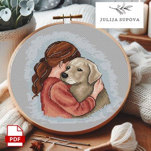Puede incluir: Bordado de punto de cruz en un aro de madera. El diseño presenta a una persona abrazando a un perro, en tonos marrones, rojos y grises. El texto "JULIJA SUPOVA" es visible. Un icono PDF está en la esquina inferior izquierda.
