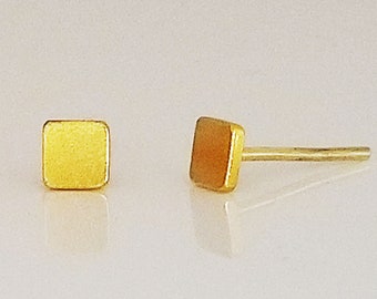 24 Karat gold flat and 24 Karat post earrings