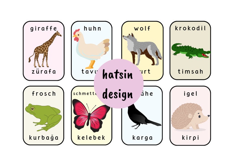 May include: Eight colorful flashcards with images of animals and their names in German and Turkish. The animals include a giraffe, chicken, wolf, crocodile, frog, butterfly, crow, and hedgehog.