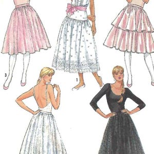 May include: A sewing pattern for five different skirts. The skirts are all different lengths and styles, and some have lace trim. The pattern includes instructions for making each skirt.