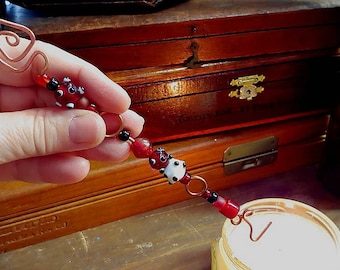 multipurpose handmade candle snuffer suncatcher magick wand Christmas ornament in hammered copper with red and black and white glass beads