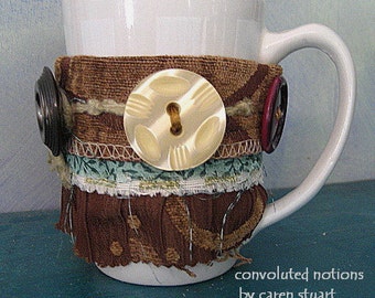 handmade coffee cup cozy fabric bracelet wrist cuff with large vintage buttons and upcycled fabric