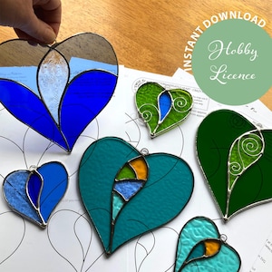 May include: Stained glass heart decorations in shades of blue, green, and teal, with silver-coloured metal edging. The image includes the text "Instant Download" and "Hobby Licence".