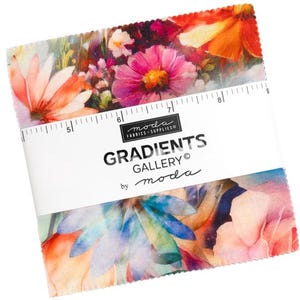 May include: A stack of square fabric swatches featuring a vibrant floral print with pink, orange, and blue petals. A white paper band wraps around the center, printed with 'MODA FABRICS + SUPPLIES', 'GRADIENTS GALLERY', and a 5-inch ruler scale.