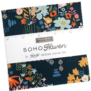 May include: A stack of fabric squares with a floral pattern in shades of blue, orange, yellow, and pink. The fabric is labeled "BOHO Haven" by "Fancy That DESIGN HOUSE & Co."