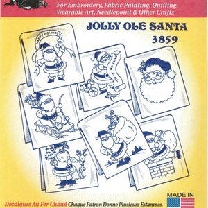 May include: A sheet of "Hot Iron Transfers" featuring multiple designs of Santa Claus in various poses. The text reads "JOLLY OLE SANTA" and "3859". The transfers are for embroidery, fabric painting, quilting, and other crafts.