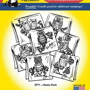 May include: A package of Aunt Martha's Iron-on Transfers featuring Hooty Owls designs. The yellow packaging displays black and white line art of various owls perched on branches, with some labeled by days of the week like Friday and Thursday.
