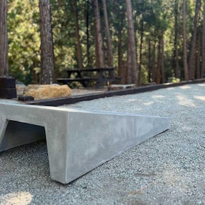 enjoying the great outdoors with a concrete cornhole board set