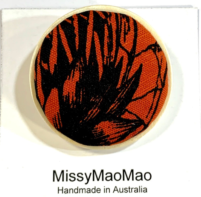 Fabric brooch large with wooden base featuring handprinted fabric.