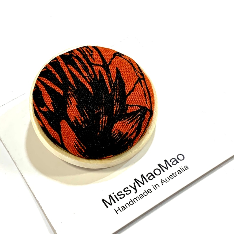 Fabric brooch large with wooden base featuring handprinted fabric.