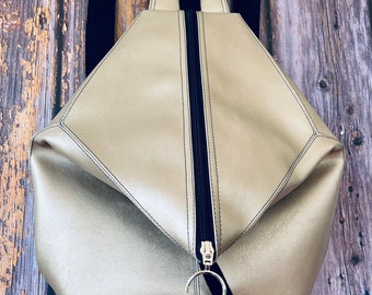 Vegan faux leather changeable backpack in high quality vinyl in gold.