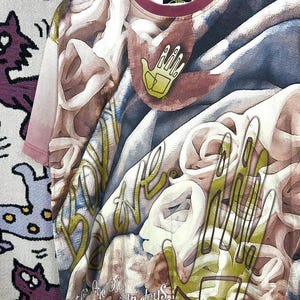 May include: A short-sleeved t-shirt with a unique, artistic design. The shirt features a complex pattern of swirling shapes in shades of brown, blue, and white, with a yellow hand graphic. The collar and sleeves have a burgundy trim. The shirt also has text.