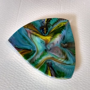 May include: A triangular, colorful, abstract art piece with swirls of blue, green, yellow, brown, and white paint.