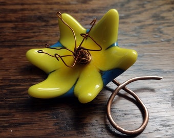 Yellow and blue fused glass lily like flower with copper stem and stamens