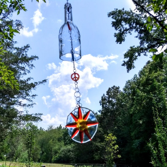 Items similar to Recycled clear glass bottle with fused glass sun