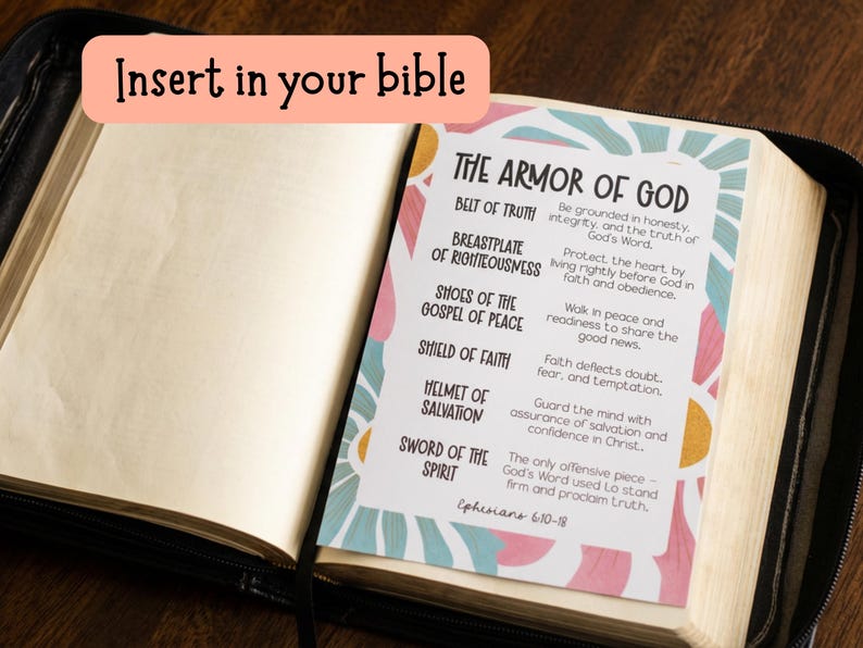May include: Open Bible with a colorful insert titled "The Armor of God." The insert lists the elements of the armor with corresponding descriptions. The text "Insert in your bible" is in a pink bubble at the top.