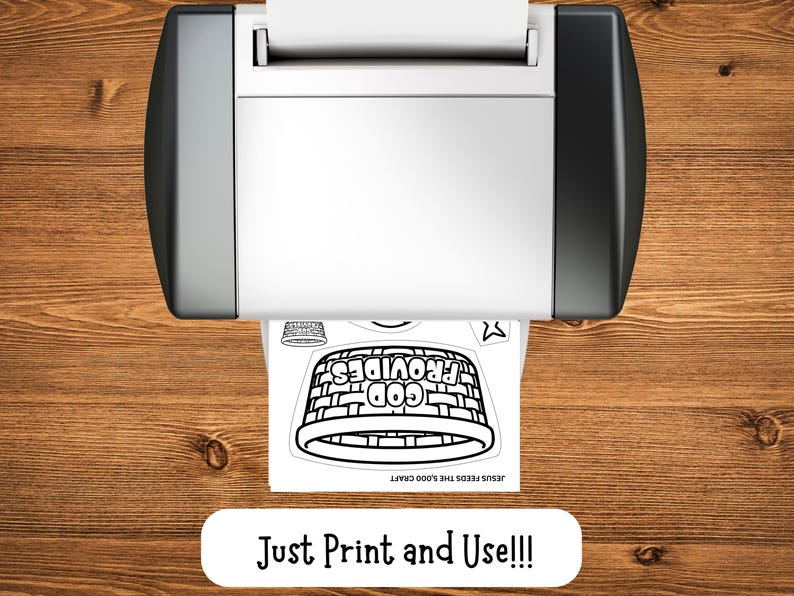May include: A printer is shown from above, printing a black and white image of a basket with the words "GOD PROVIDES" and "JESUS FEEDS THE 5,000 CRAFT". The text "Just Print and Use!!!" is below the printer.
