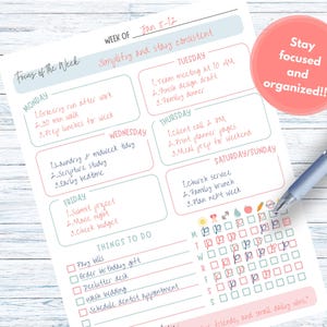 May include: A weekly planner with a light blue and pink design. The planner includes sections for each day of the week, with space to write down tasks and appointments. The text "Stay focused and organized!!" is in a pink circle.