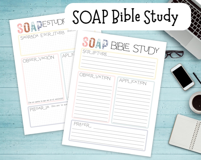 May include: Two white SOAP Bible Study worksheets with lined sections for Scripture, Observation, Application, and Prayer. The worksheets have pastel-colored borders and the title "SOAP Bible Study" in black and colorful letters. A laptop, phone, and coffee cup are in the background.