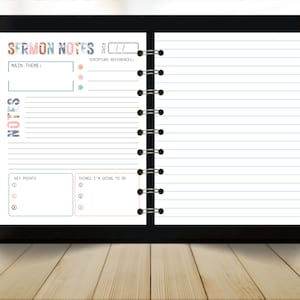 May include: A black spiral-bound notebook with the words "SERMON NOTES" in colorful letters at the top. The notebook has lined pages for note-taking, with sections for the main theme, scripture references, key points, and things to do. The notebook is open on a wooden surface.