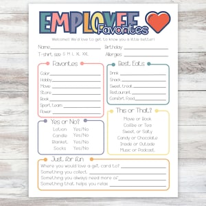 May include: A printed employee questionnaire titled "EMPLOYEE Favorites" with a colourful design and a red heart graphic. The form includes sections for personal preferences and "This or That?" questions, printed on white paper.