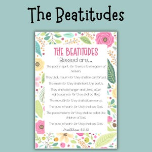 May include: A decorative print featuring the text "The Beatitudes" in a whimsical font. The print includes the text of the Beatitudes, surrounded by a floral border with pink and yellow flowers and green leaves. The background is a light teal color.