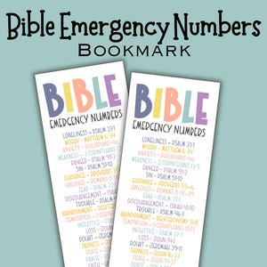 May include: Two bookmarks with the text "Bible Emergency Numbers." The word "Bible" is in colorful letters. The bookmarks list Bible verses for various situations like loneliness and doubt. The background is a light teal color.