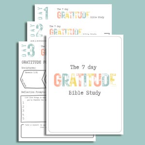 May include: A stack of white paper sheets with the text "The 7 day GRATITUDE Bible Study" in colorful letters. The sheets include prompts and scriptures for a gratitude-focused Bible study.