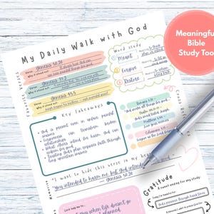 May include: A white sheet titled "My Daily Walk with God" with handwritten notes and sections for verses, word study, and gratitude. A blue pen lies on the paper. Measurements are not applicable.