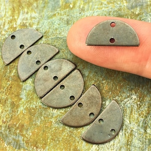 May include: Five antique silver half-circle metal charms with three holes each. The charms are arranged in a row, with the largest charm at the top and the smallest charm at the bottom.