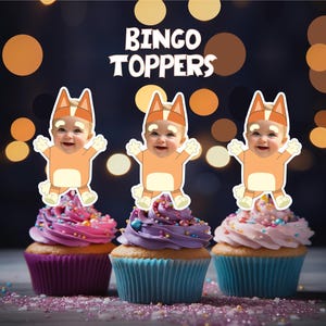 May include: Three cupcake toppers featuring a cartoon dog wearing a blue and orange costume. The dog has a human baby's face. The toppers are on top of cupcakes with pink, purple, and white frosting. The text "Bingo Toppers" is at the top of the image.