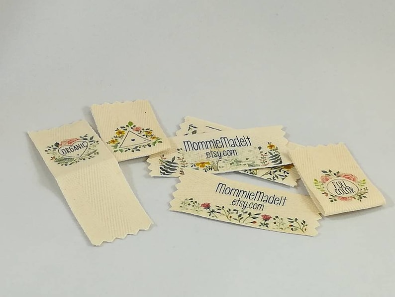 May include: A set of six small, rectangular, cream-colored fabric labels with floral designs and text. The labels feature the text "Organic", "Full Color", and "MommieMadeIt etsy.com".