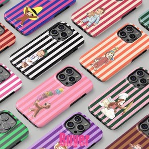 May include: A collection of colorful phone cases featuring cartoon monkey illustrations. Designs include striped patterns in various colors, with the monkey in different outfits and poses. The cases are for a smartphone.