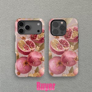 May include: Two phone cases with a pomegranate design. The cases feature a pattern of whole and halved pomegranates in shades of red and pink, with gold accents and leaves. The cases have a light pink background.